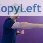 Man Punching in the Air while in VR Goggles