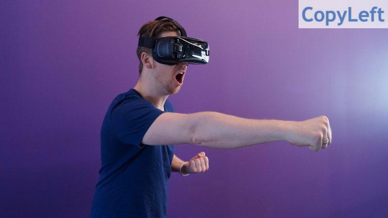 Man Punching in the Air while in VR Goggles