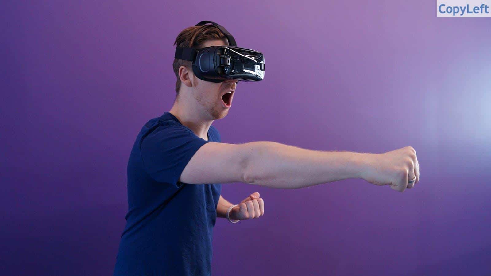 Man Punching in the Air while in VR Goggles
