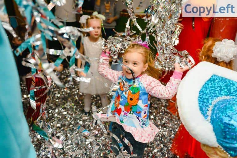 Photo of Girl Having Fun in Birthday Party
