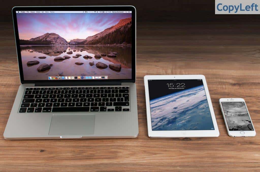 Macbook Pro Beside White Ipad