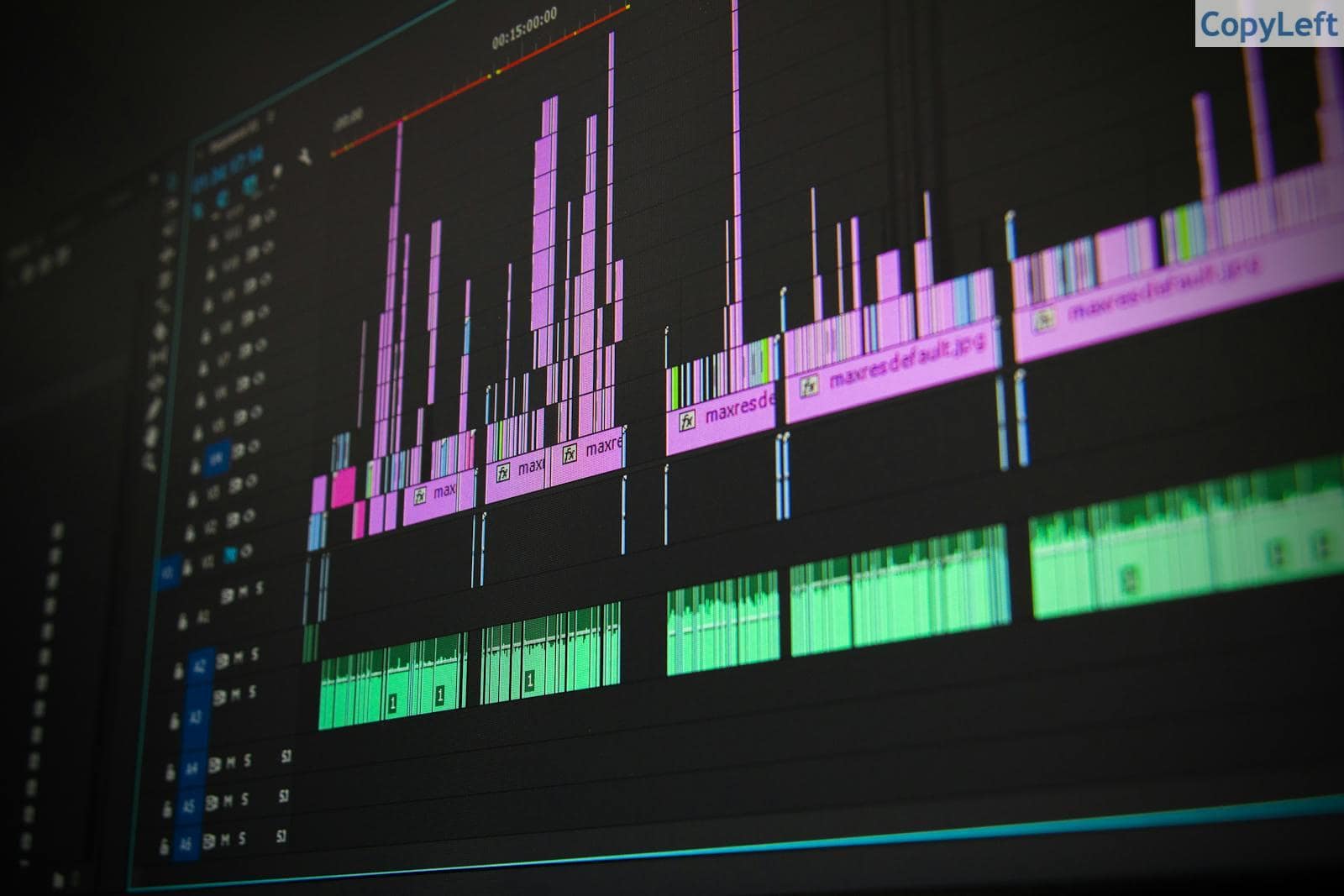 Close-up of a professional audio and video editing software interface with waveform displays.